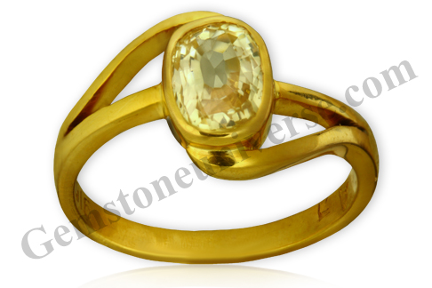 Golden Yellow Sapphire set in double helical band 22KDM Gold ring. Natural Yellow Sapphire the gem of Jupiter-The planet that blesses with auspicious wealth, love and knowledge and is a favourite as an engagement ring. Gemstoneuniverse.com