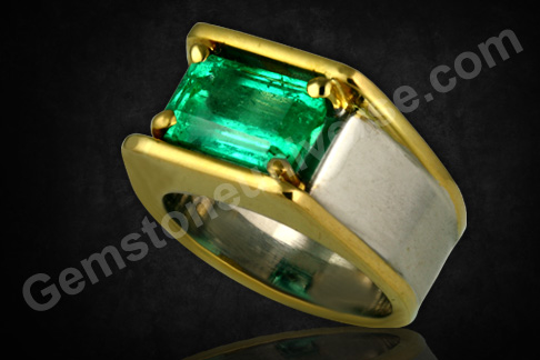 Enthralling and collectible Emerald set in an equally enthralling two-tone gold ring and making an exclusive statement! A scintillating fully natural and unenhanced Emerald! A regal Mercury talisman! Gemstoneuniverse.com