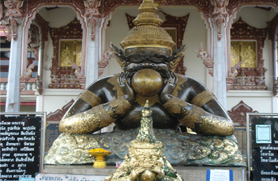 Wat Srisathong - Rahu statue in Thailand showing Rahu swallowing Sun and causing Eclipse