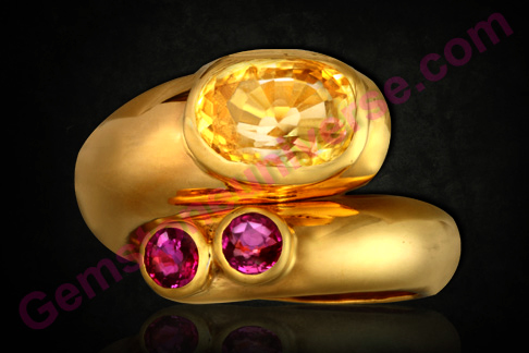 Unheated Yellow Sapphire of 4.13 carats and a matching pair of unheated Tajik Rubies
